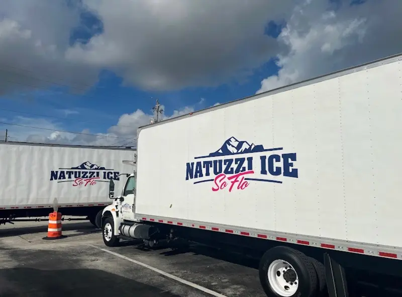 Two Natuzzi Ice SoFlo box trucks parked side by side at our Fort Lauderdale plant